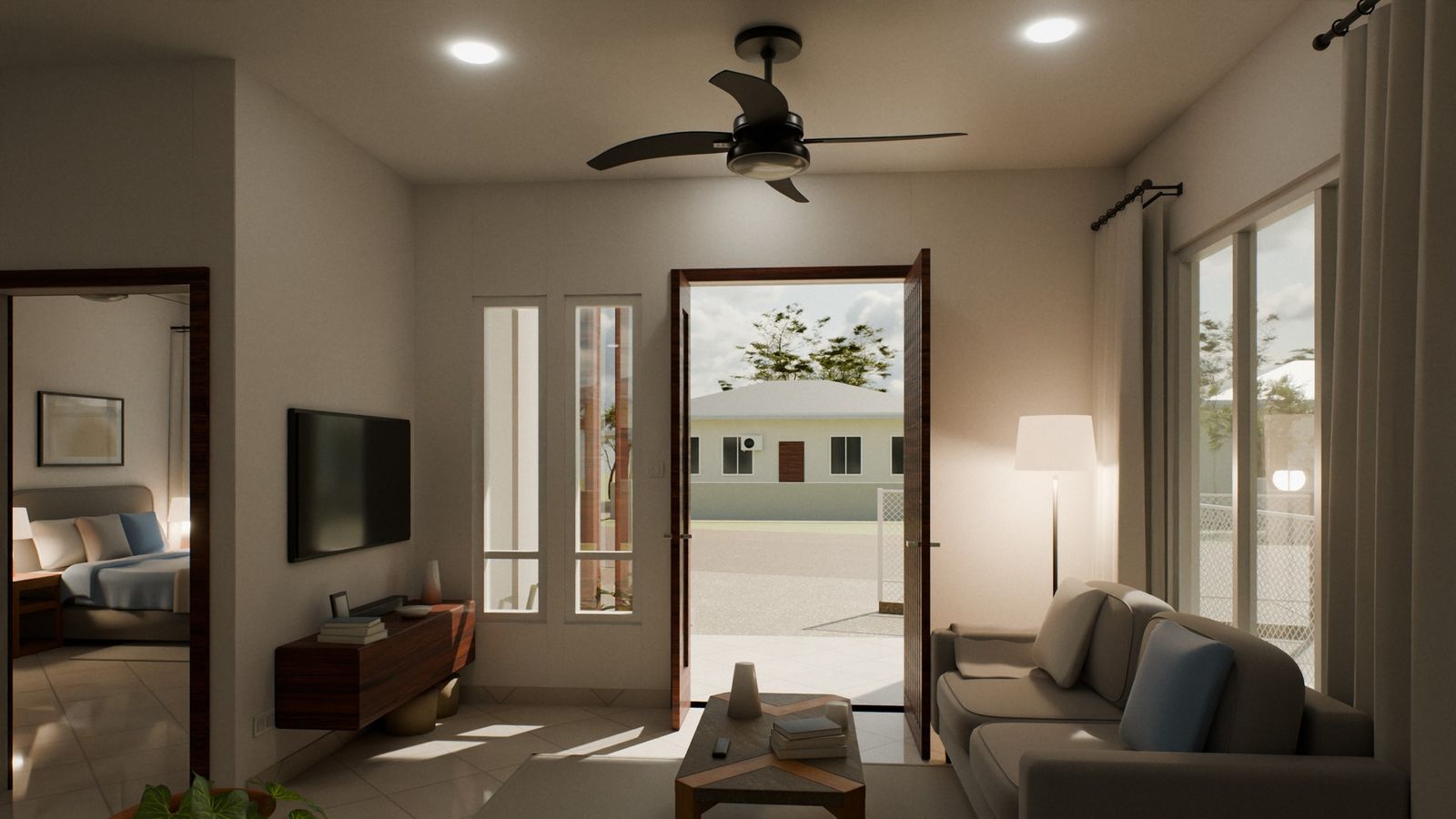 The living room with a sofa, a ceiling fan and the front door open to the porch.